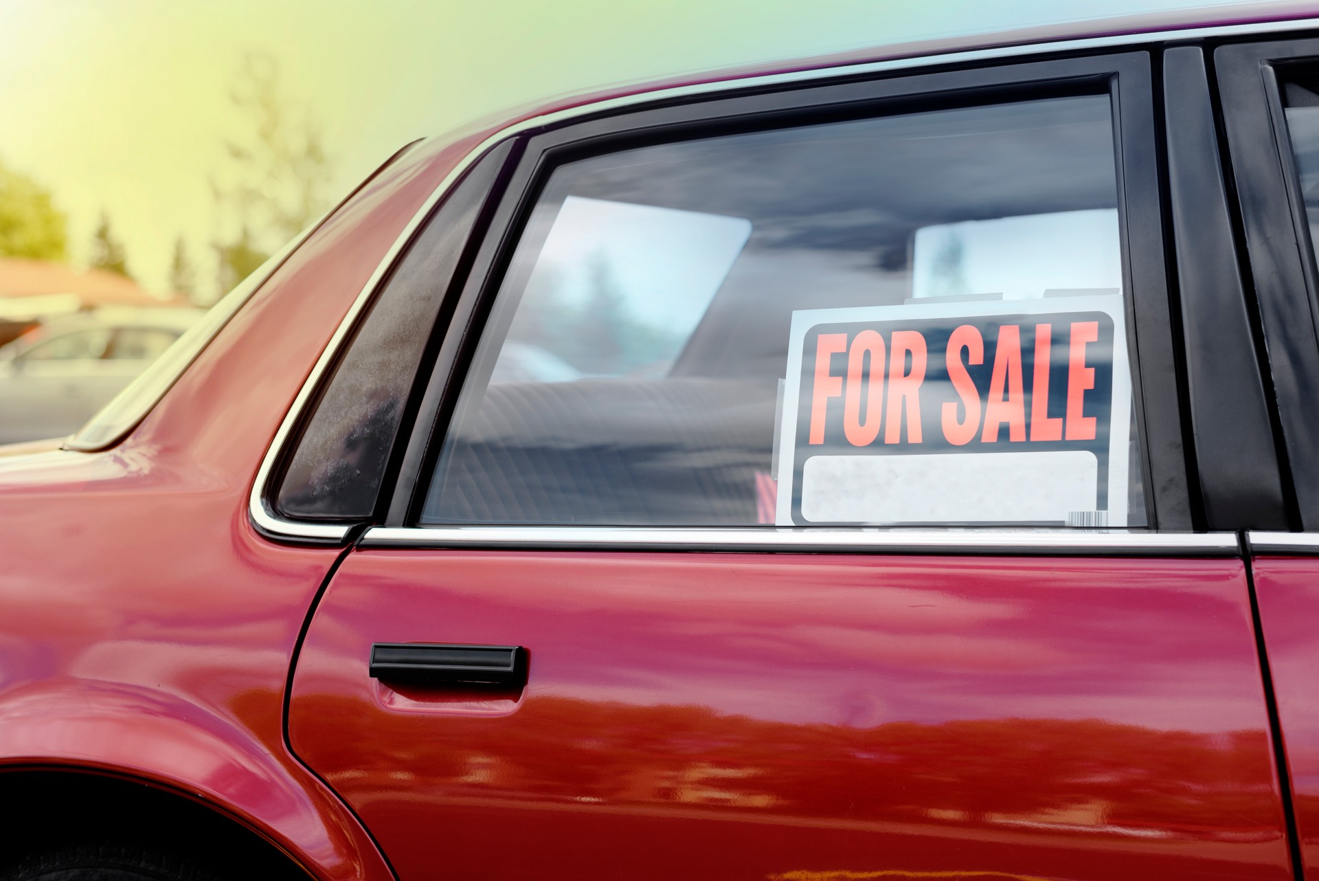 shiny car for sale in summer weather